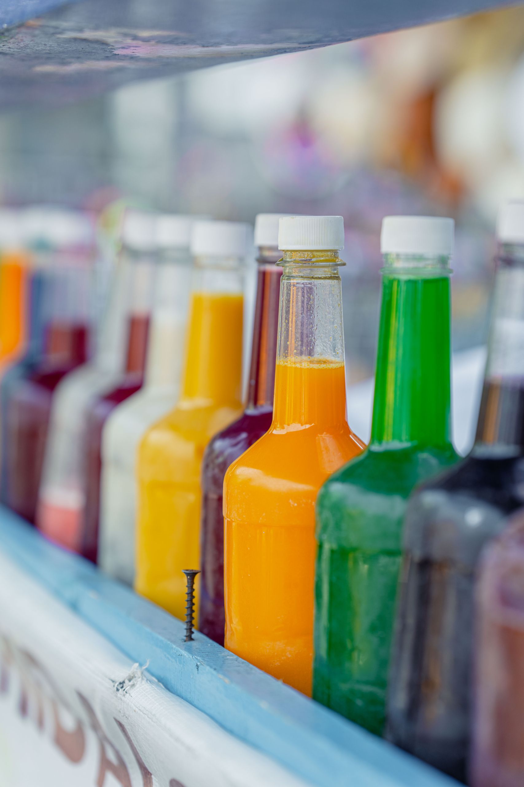 Vibrant selection of multi-colored bottled drinks in Mexico City. Perfect for beverage-related designs.
